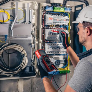 man-electrical-technician-working-switchboard-with-fuses